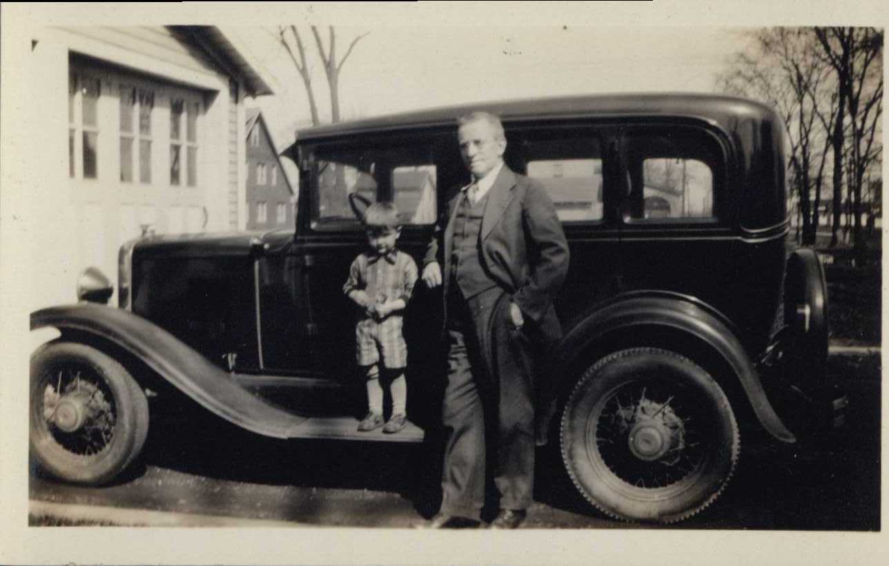 George Eynon and Child Outside of Car, undated